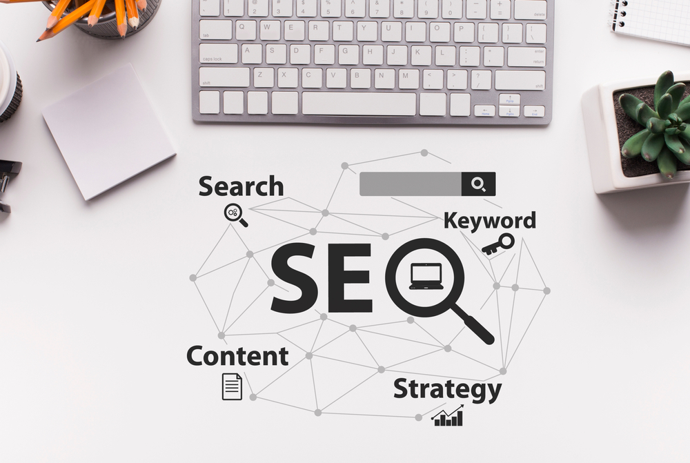 SeoStrategySeo-optimizationSchemeWithWordsOverWhiteOfficeDesk seo strategy diagram with optimization keywords arranged on a desk, representing search engine optimization planning and website improvement.