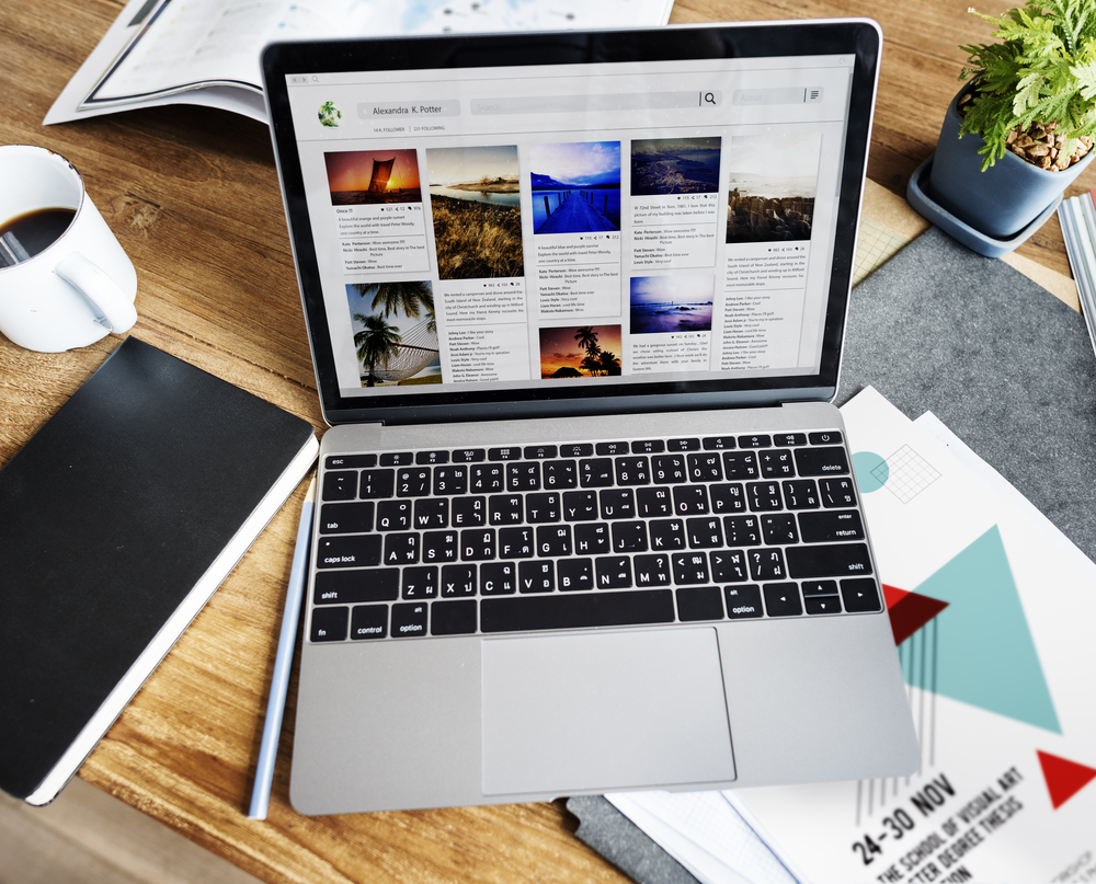 LaptopBloggingShareSocialMediaConcept Person working on a laptop creating blog content and managing social media marketing